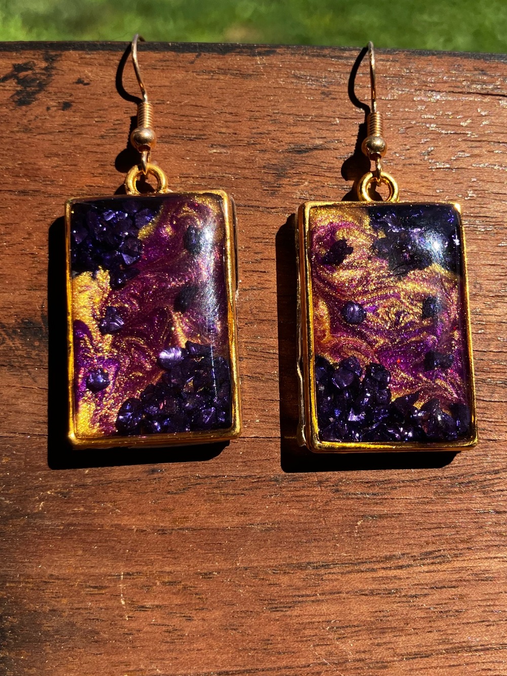 Purple and gold dangle earrings with rock accent